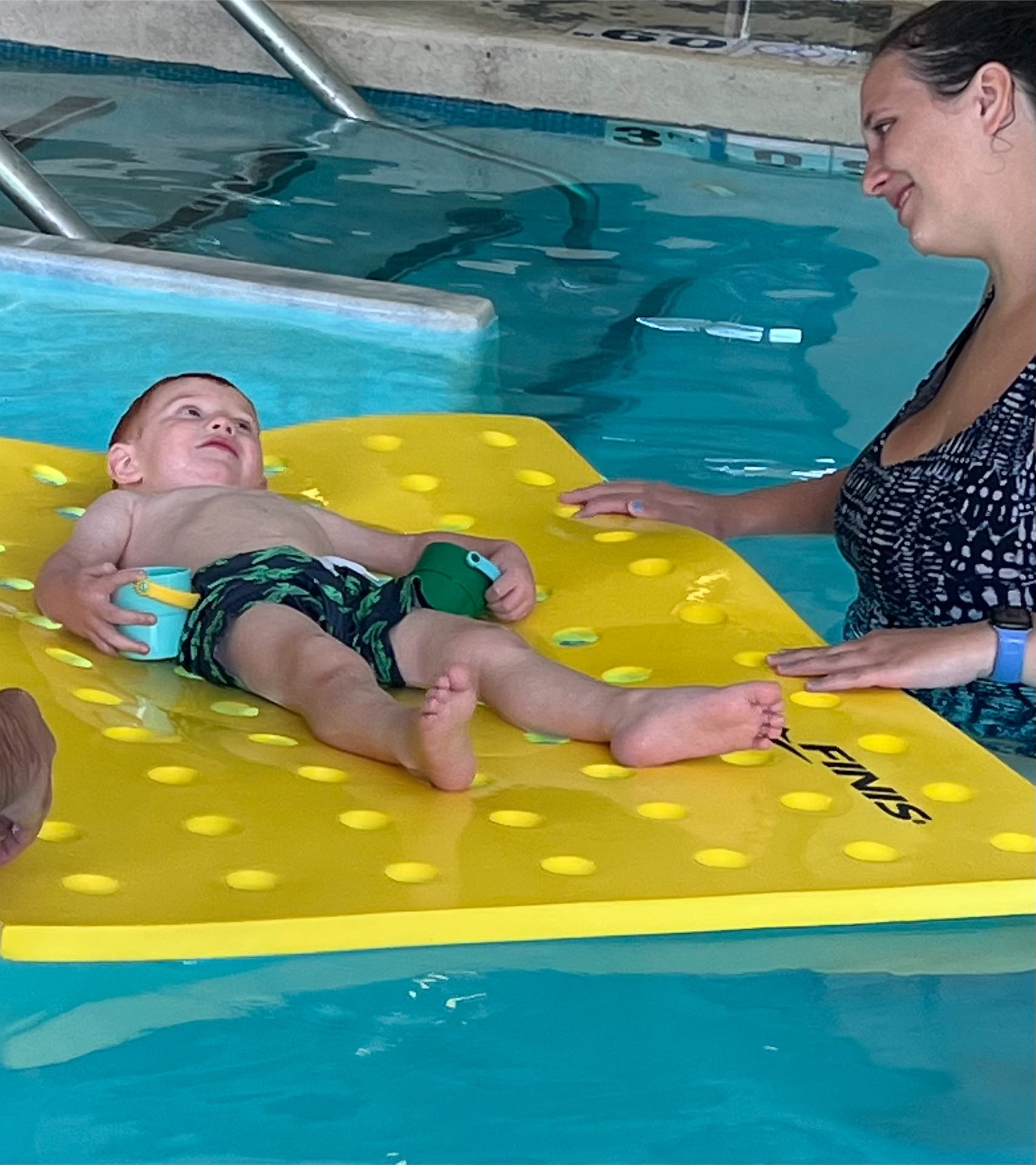 Child doing the backstroke during a private lesson in Edmond, Oklahoma