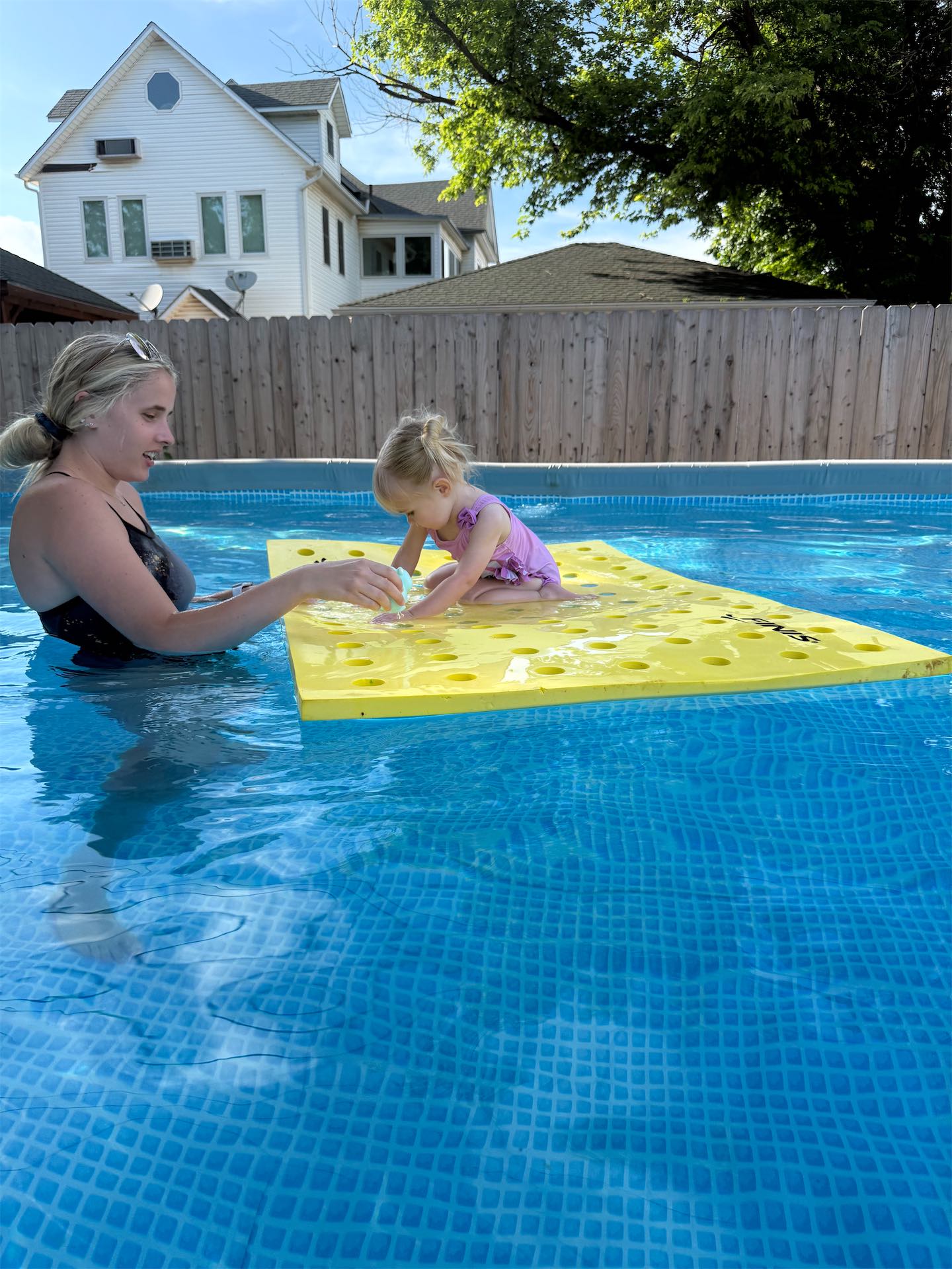 Child learning to back-float with a Like a Fish instructor in OKC