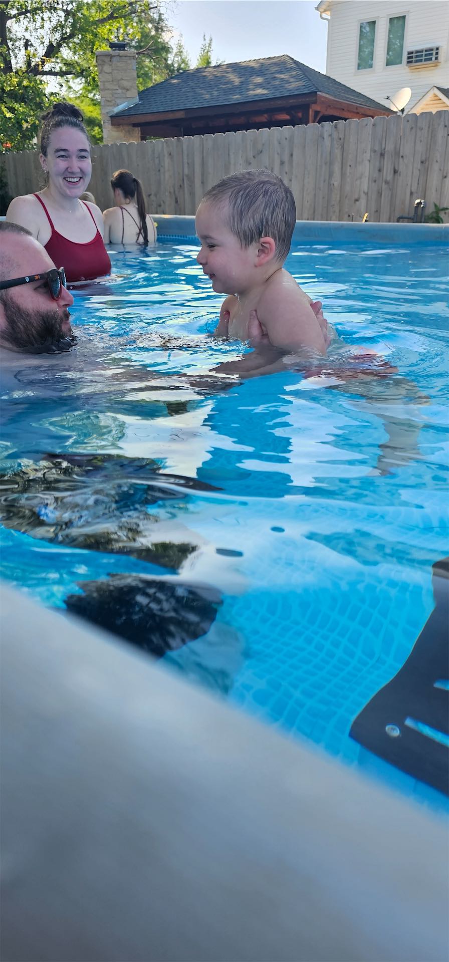 Group swim lesson with kids practicing freestyle in Edmond